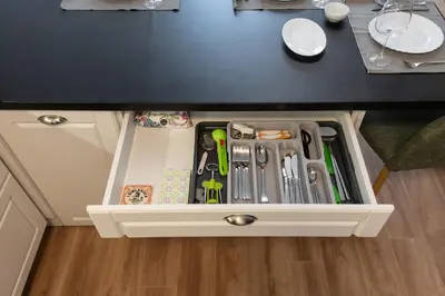 a drawer in a cabinet filled with utensils at Sofia Apartment with Free Parking in Sofia