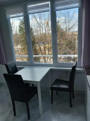 a table and two chairs in front of a window at 2 bdrm appartment in Sofia - Lulin in Sofia
