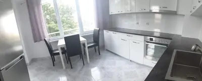 a kitchen with a table and chairs and a stove at 2 bdrm appartment in Sofia - Lulin in Sofia