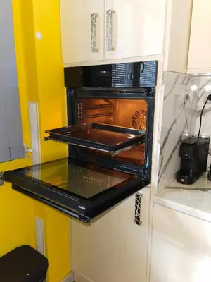 a kitchen with an oven with a pan in it at Sofiel cozy apartment - Top Center Sofia in Sofia