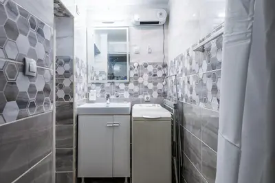 a white bathroom with a sink and a mirror at 2BD Citrus Apartment, Aristocratic Sofia Living by Flat Mаnager in Sofia