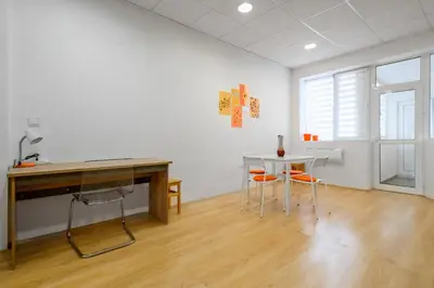 a white room with a table and a table and chairs at 2BD Citrus Apartment, Aristocratic Sofia Living by Flat Mаnager in Sofia