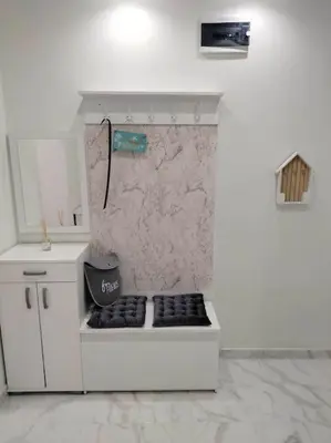 a white room with a counter and a sink and a counter at Alinik Apartment in Sofia