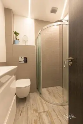 a bathroom with a shower and a toilet in it at La Corte dei Bohem in Sofia