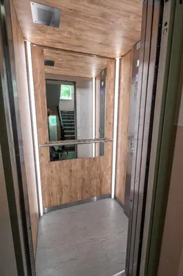 a hallway with a mirror in a room at Vitoshka's Finest in Sofia