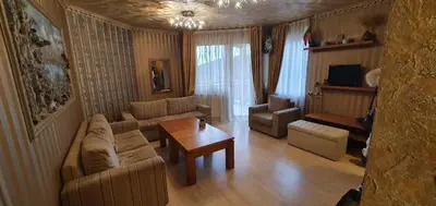 a living room with a couch and a table at Harriet Hill Designer Bansko in Bansko