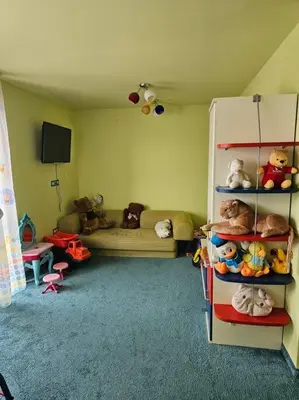 a childs room with a play room with a toy refrigerator at Bansko Private VIP Apartment in Bansko