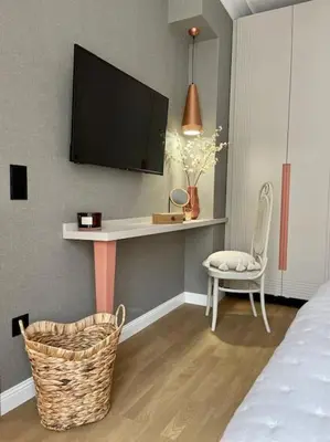 a bedroom with a desk with a tv on the wall at Luxury 2 Bedroom Top Central Apartment in Sofia