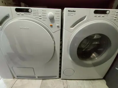 a washing machine next to a dryer in a room at 5munutes from the airport & 15 from the City center in Sofia