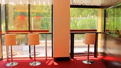 a room with two chairs in front of windows at Hotel Dream in Sofia