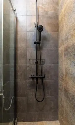 a shower with a shower head and a shower at Private House in the Center of Plovdiv in Plovdiv