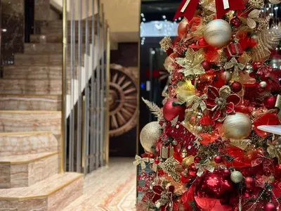 a christmas tree with red and gold ornaments at Hidden Bank: Pearls in Plovdiv