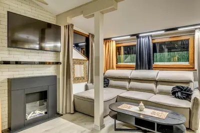 a living room with a couch and a fireplace at Top 5 - Loft - Top Location - Designer Interior in Sofia