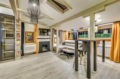a living room with a fireplace and a table at Top 5 - Loft - Top Location - Designer Interior in Sofia