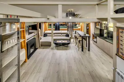 an open living room with a dining room and a kitchen at Top 5 - Loft - Top Location - Designer Interior in Sofia