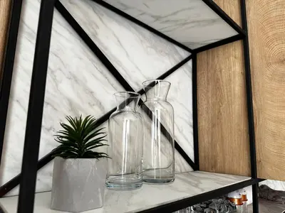 two glass vases sitting on a shelf with a plant at Апартамент НИА in Velingrad